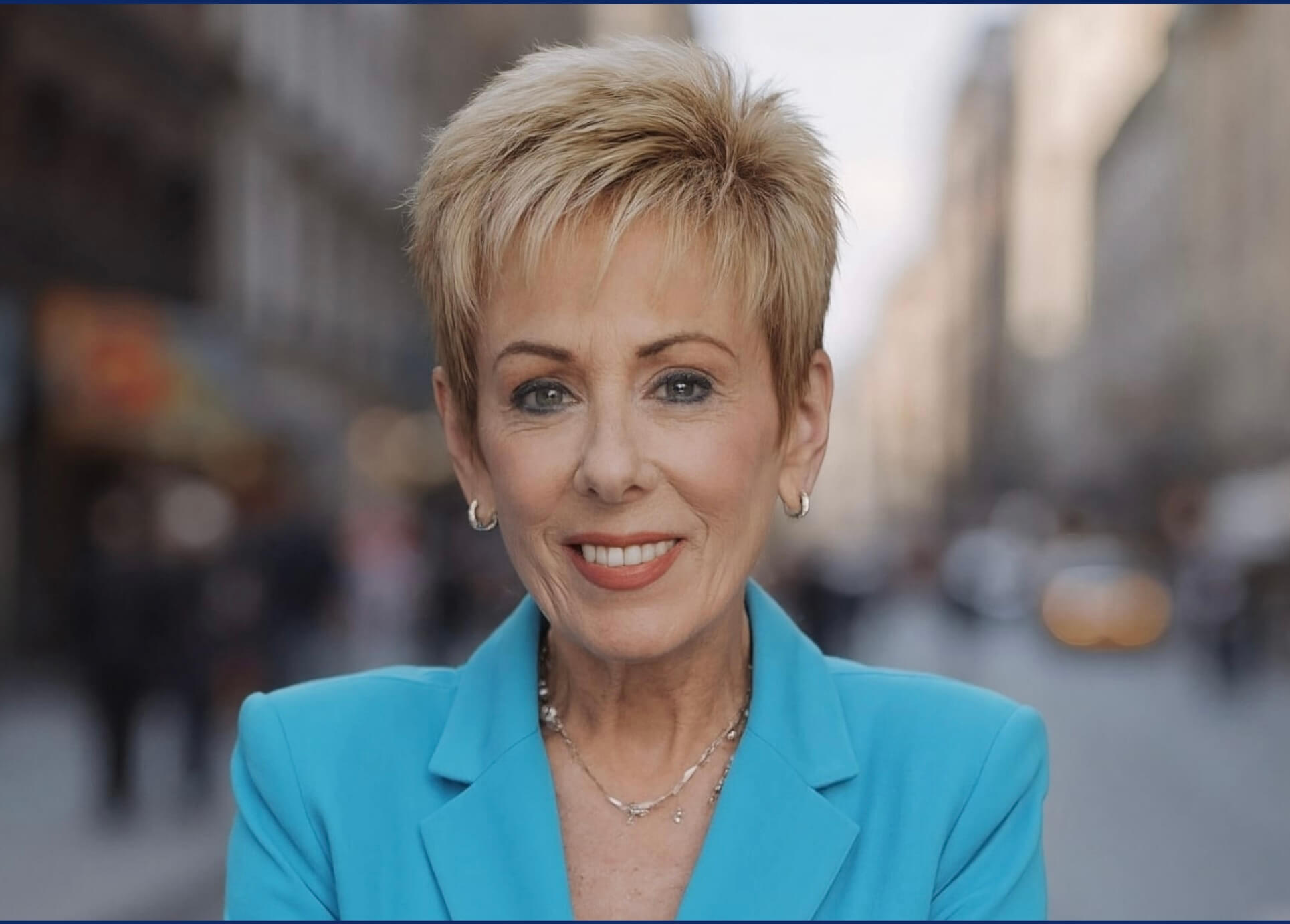 Smiling woman in turquoise blazer on city street